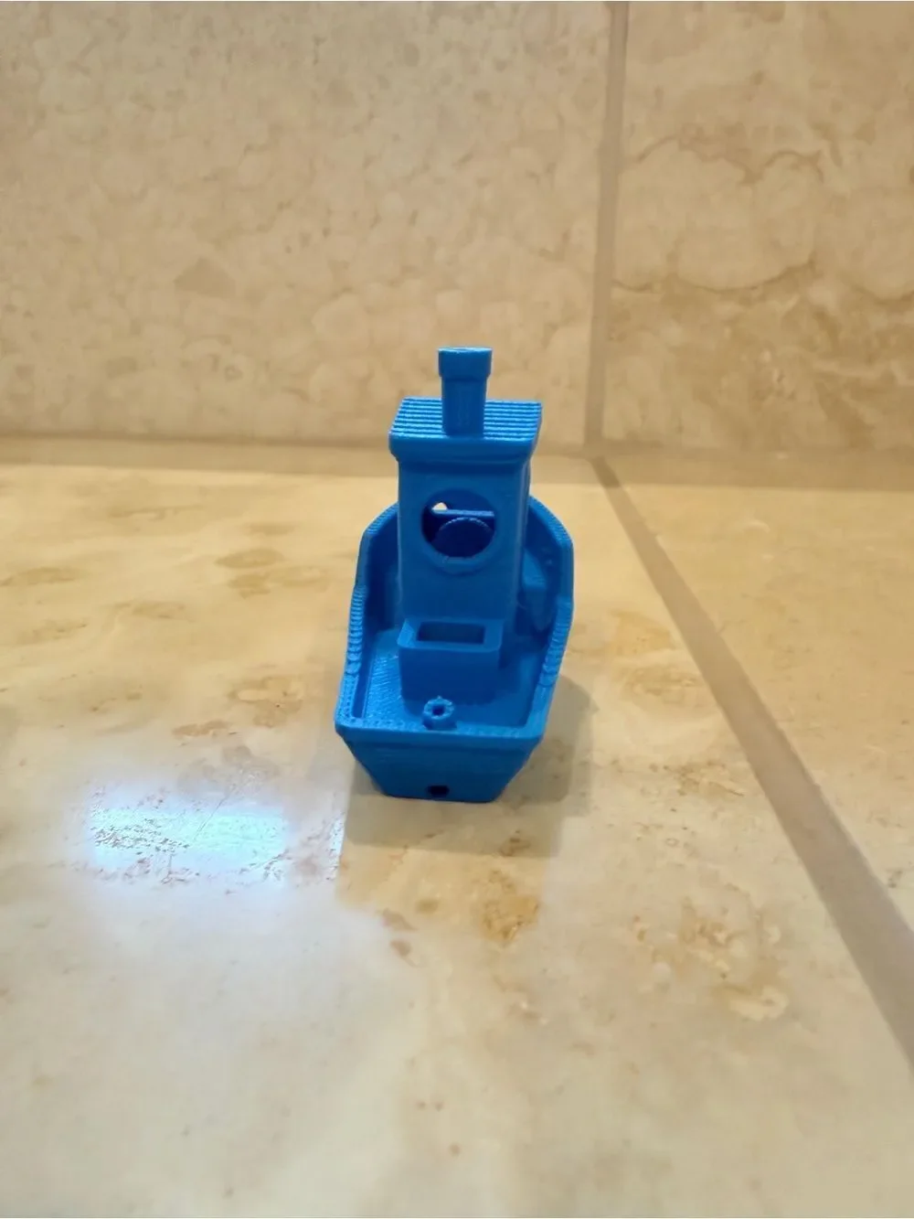 Small 3D-Printed Toy Boat in Bright Blue